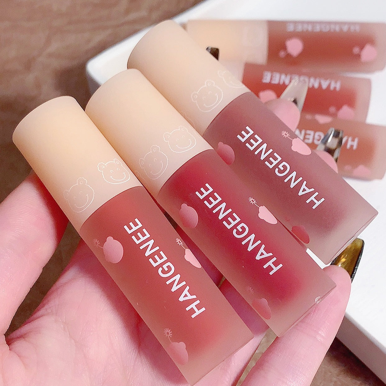 &HANGENEE Han Jini Firework Bear Lip Glaze Niche Brand Mirror Water Glossy Lip Glaze Affordable Lipstick Wholesale